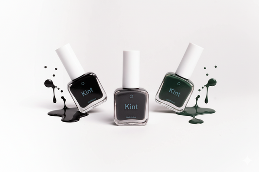 Kint Nail Polish with cool splashes of color on a blank background
